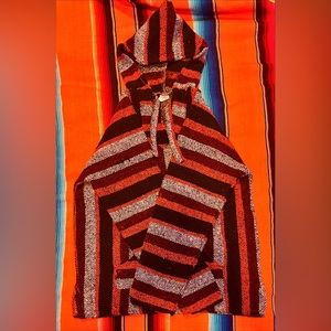 Orange, black, and white drug rug.